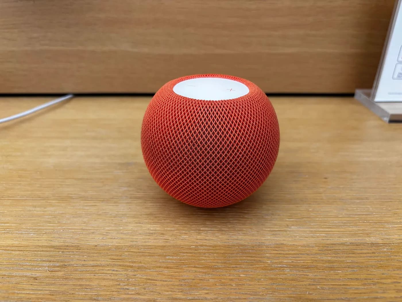 A first-generation orange HomePod mini, launched in 2020 at $99. Its successor, unveiled on October 13, costs $149 in the United States.