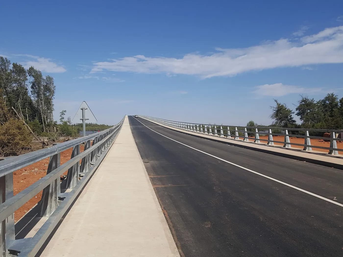 The Senegambia Bridge, between Farafenni and Soma, days after it opened in January 2019. Senegalese drivers who use it are travelling through The Gambia, where their Brown Card is what covers them if they have an accident.